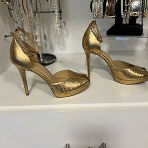Michael Kors gold high heeled sandal. Comfortable platform shoe